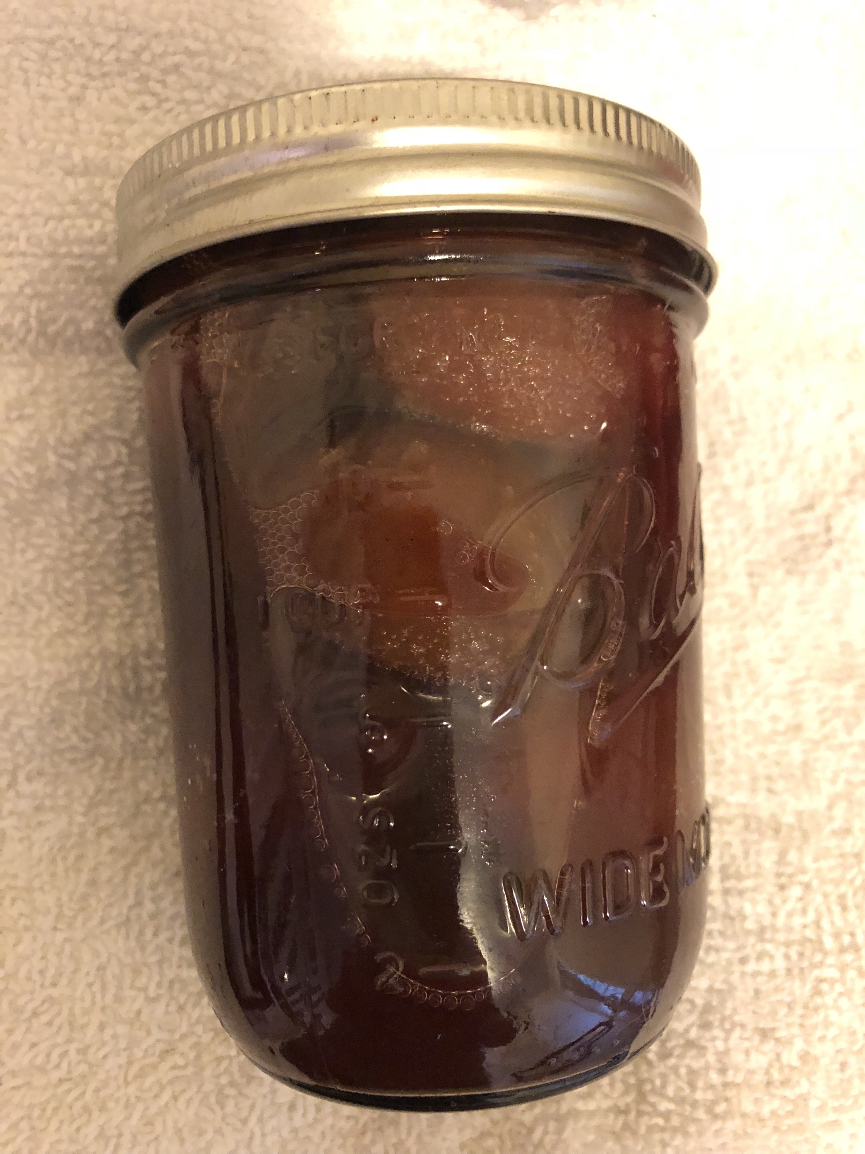 Jar with preserved plums